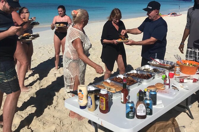 7 Hour Private Catamaran Sail, Snorkel and Beach BBQ Grace Bay, Providenciales - Half Moon Bay: sandbar walking, lagoon vibes, and native rock iguanas