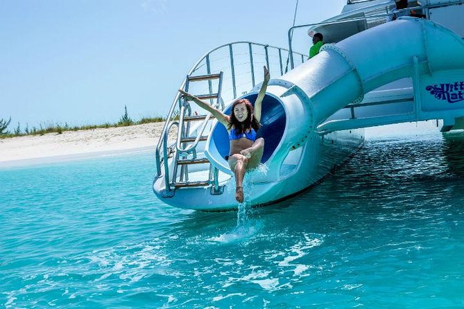Family Catamaran & Snorkeling Cruise Turks & Caicos - Shore time on the sand, shell hunting, and relaxing breaks