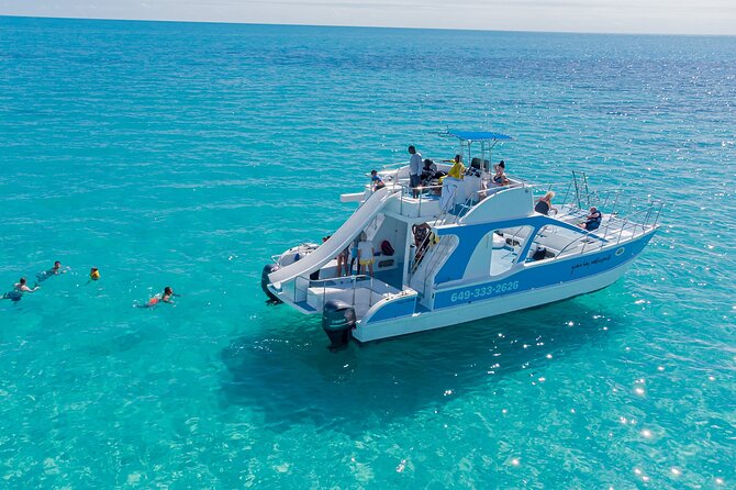 Private 4-Hour Catamaran Tour from Providenciales in Turks and Caicos - Half Moon Bay swim time: where the snacks and rum punch kick in